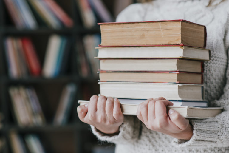 a person holding books