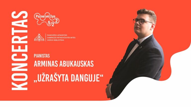 Jaunas vyras juodu kostiumu oranžiniame fone
